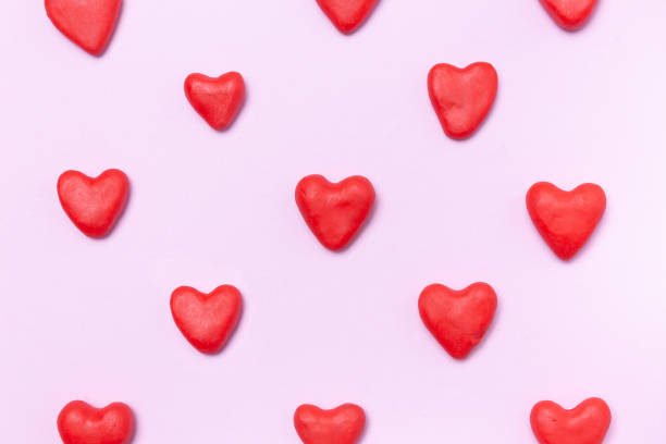 istock Hearth shape molding clay on pink background 1130533571