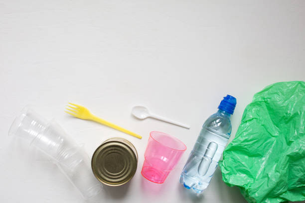 istock Ecology concept. Plastic cups, tin cans and bag for recycling. 1130535581