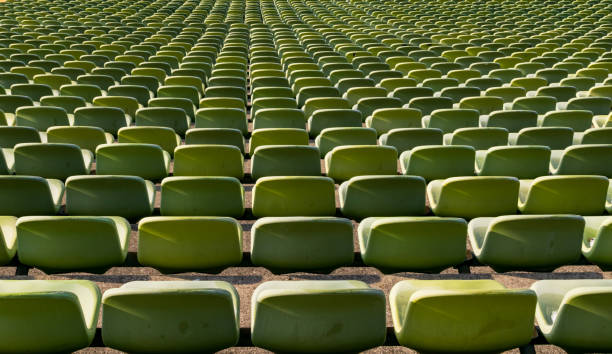 istock Green seat shells in a football stadium 1130536196