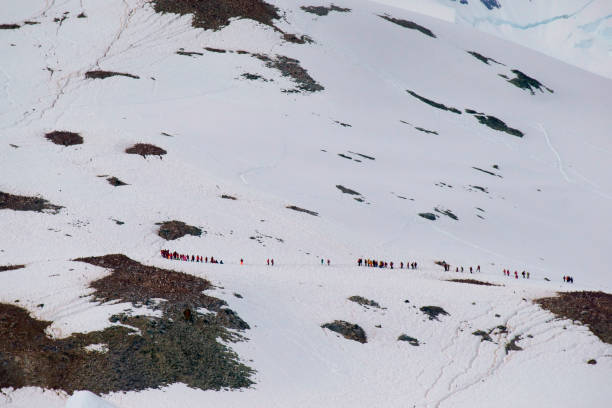 istock people hike  Antarctic Peninsula mountain Orne Harbour Gerlache Strait Antarctica 1130536222