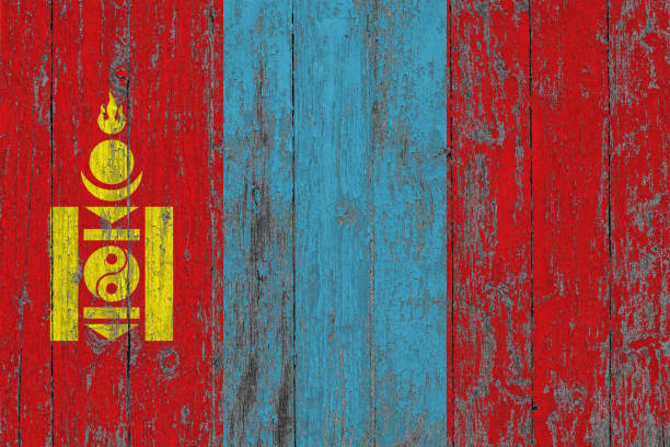 Flag of Mongolia painted on worn out wooden texture background.