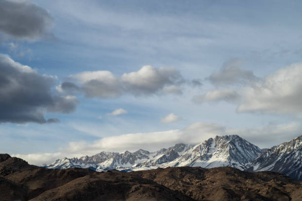 istock brown autumn desert hills snowy mountain ridge 1130538478