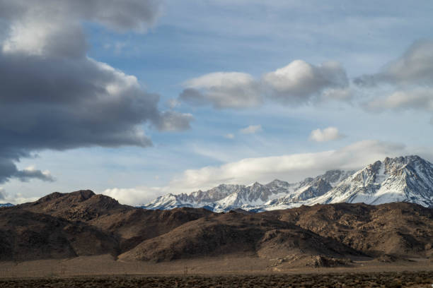 istock brown autumn desert hills snowy mountain ridge 1130538483