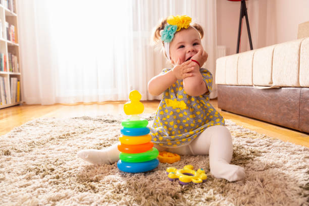 istock Baby girl playing with stack of circles 1130538920