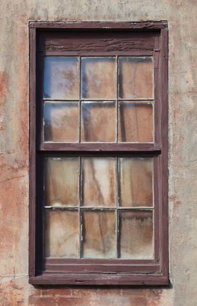 istock Old Window and Frame on Wall in need of Repair 1130539087