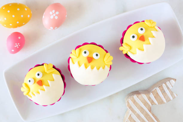 istock Hatching spring chick cupcakes on a plate, top view against a whitebackground 1130539809