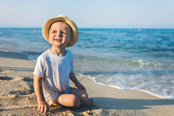 istock Happy baby boy at the beach 1130540618