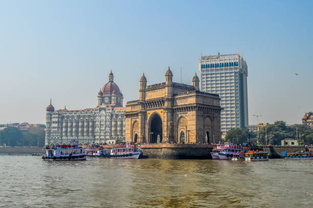 Beautiful Gateway of India  on the Mumbai harbour with many jetties on Arabian sea Beautiful Gateway of India on the Mumbai harbour with many jetties on Arabian sea near Chhatrapati Shivaji monument archaelogy stock pictures, royalty-free photos & images