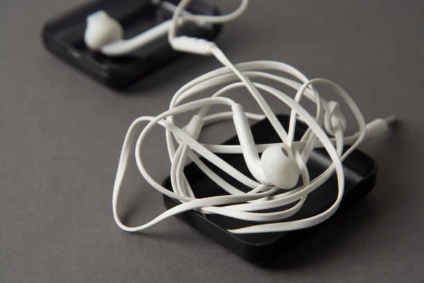 istock White headphones isolated on grey background. Gadget and accesories. 1130541487