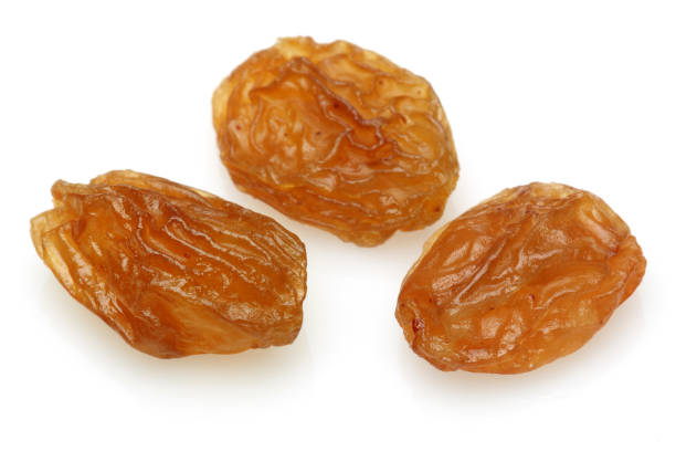 Golden raisin isolated on white Golden raisin isolated on white background feeding grapes stock pictures, royalty-free photos & images