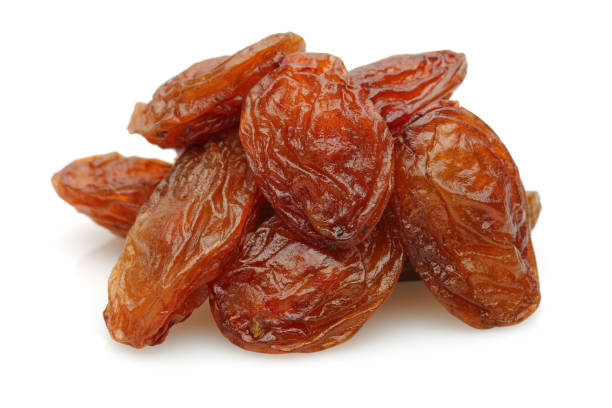 Golden raisin isolated on white Golden raisin isolated on white background feeding grapes stock pictures, royalty-free photos & images