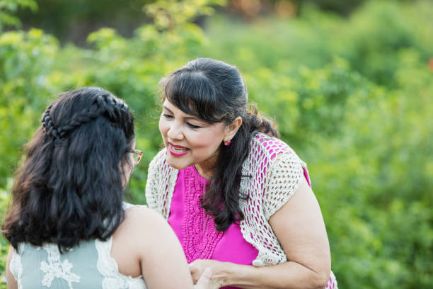 istock Hispanic woman with granddaughter, talking 1130543607