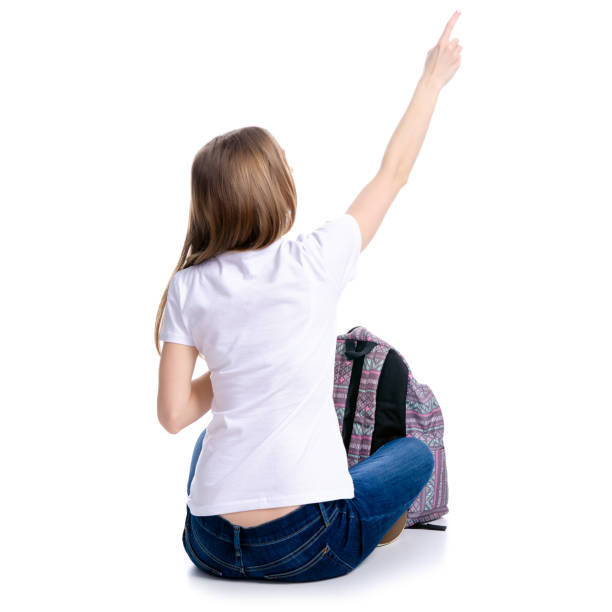 istock Woman sitting with backpack showing 1130543862