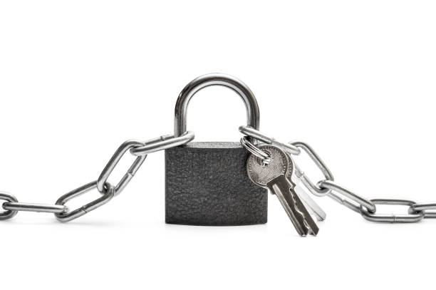 istock Padlock with keys and metal chain on white. 1130544744