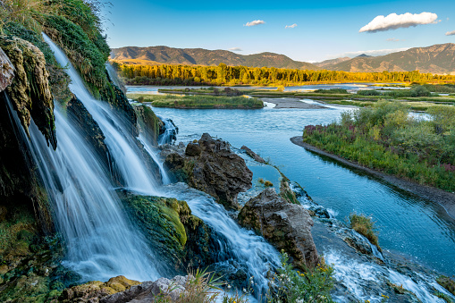 Small water fall flows into the Snake River in Idaho