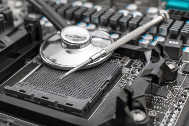 istock Stethoscope with screwdriver on motherboard. Diagnostics and repair computers. 1130545512