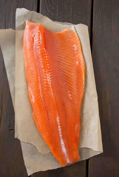 istock fresh trout fillet on wooden surface 1130546266