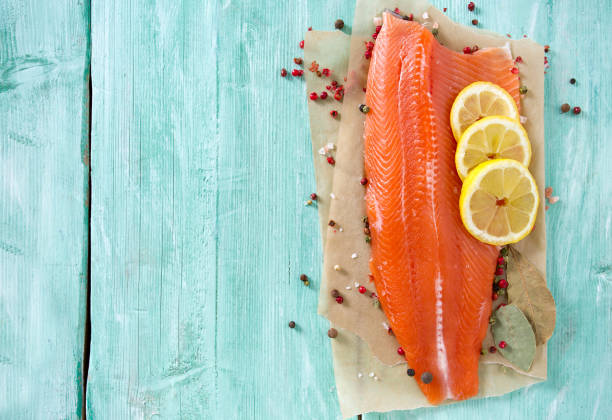 fresh trout fillet on wooden surface fresh trout fillet on wooden surface healthy eating red above studio shot stock pictures, royalty-free photos & images