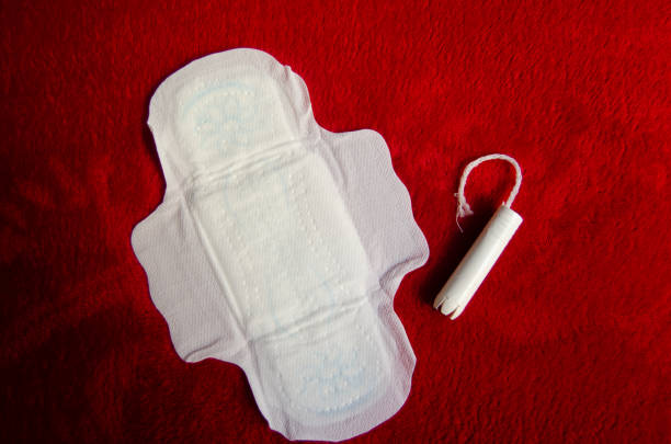 istock Sanitary pad and tampon on red blanket pms 1130546771