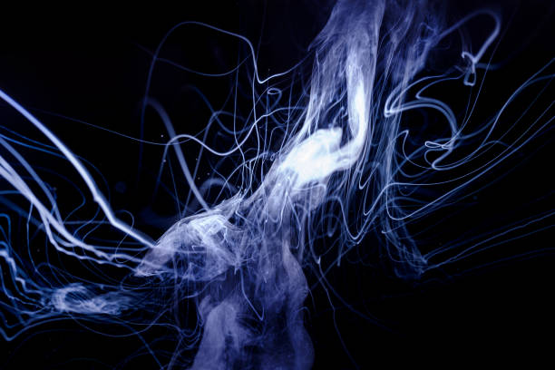 istock Vape smoke clouds isolated on black background. Hot vape liquid splash in vape coil. Nice aromatic cloud. Low light photo. Underexposed photo in a low key style. 1130548044