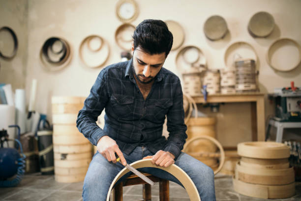 Craftsman carving a darbuka