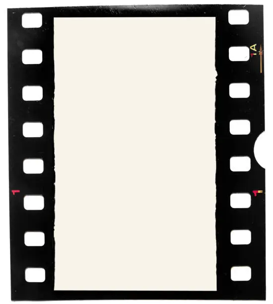 Photo of real macro photo of grungy looking 35mm filmstrip or film frame on white background