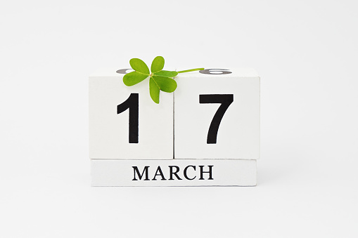 Save the date white block calendar for March 17 St Patrick's Day with clover leaf isolated on white background