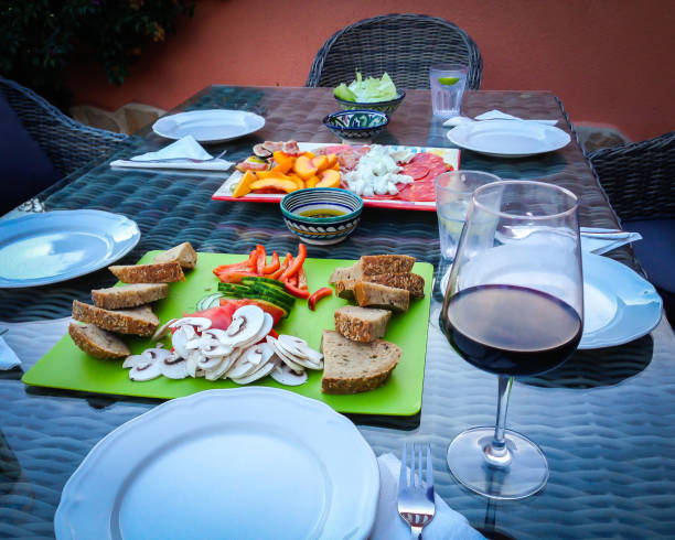 istock Dinner table with Spanish tapas and glass of red wine 1130553849