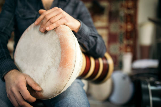Hand On Darbuka Man playing darbuka asian drum instrument guiro stock pictures, royalty-free photos & images