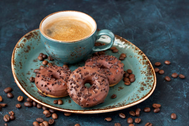 istock Tasty sweet donuts  and coffee mug 1130555807