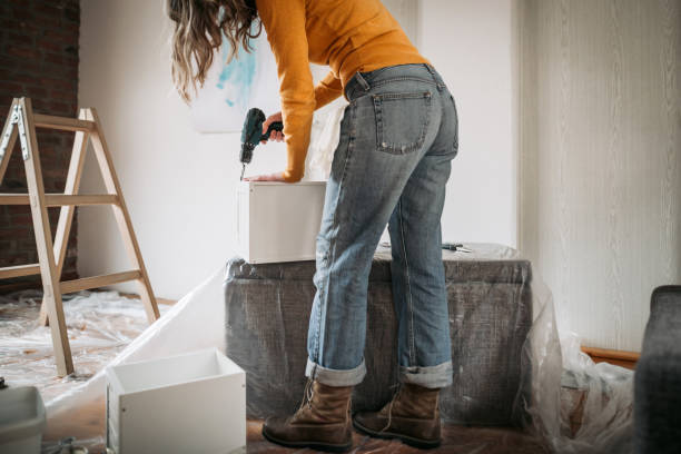 istock Woman doing repairs in house 1130555859