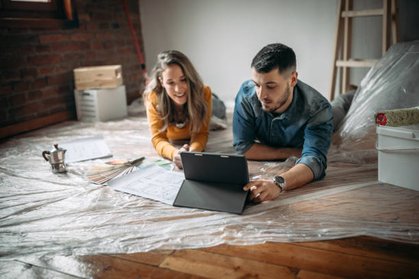 istock Happy couple lying down in new home 1130557874