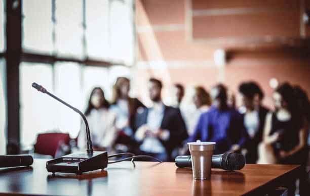 istock Close up of a microphone at a conference 1130558904