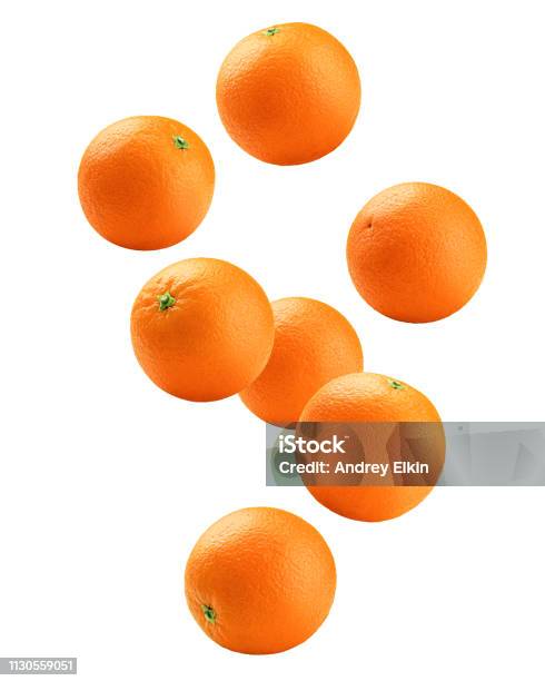 Falling Orange Isolated On White Background Clipping Path Full Depth Of Field Stock Photo - Download Image Now
