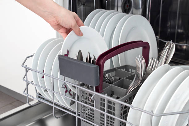 istock Open dishwasher with clean utensils in it 1130559324
