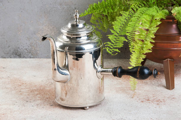 istock Vintage silver kettle with wooden handle 1130563876