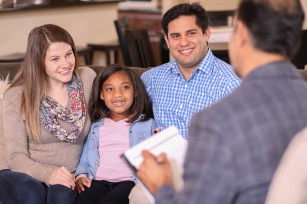 istock Family counseling session at home with therapist. 1130564568