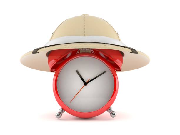 istock Alarm clock with safari hat 1130566664