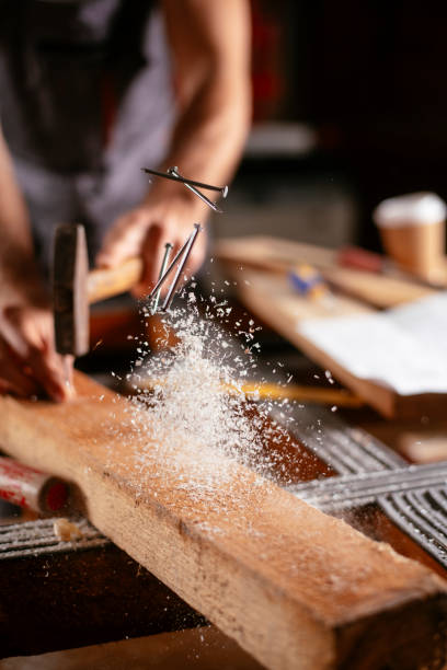 istock Close up of carpenter woodworking 1130569033