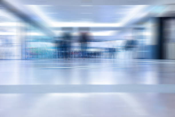 istock Motion blurred customers walking in shopping mall, Hong Kong 1130569817