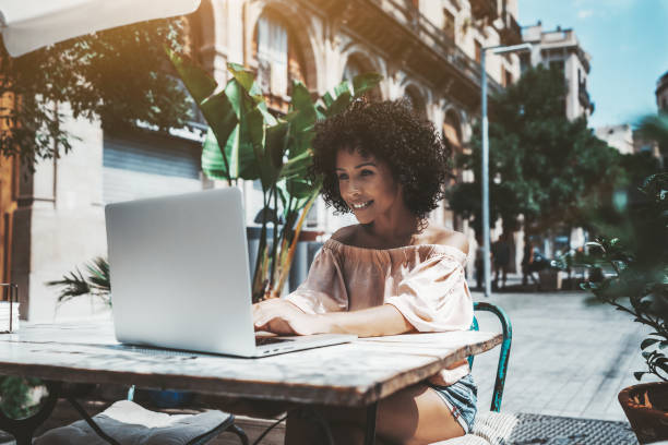 istock Mixed woman with the netbook in cafe 1130572987