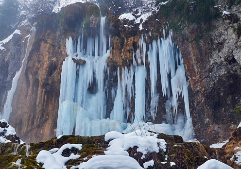 Frozen waterfall in winter time in the mountains