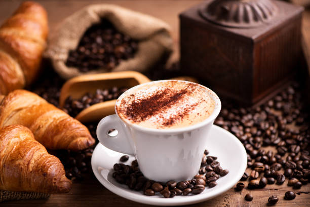 istock coffee cup close-up over dark roasted coffee beans 1130573999