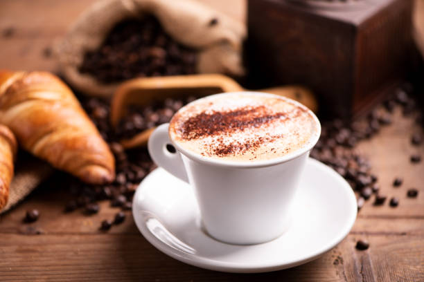 istock coffee cup close-up over dark roasted coffee beans 1130574015