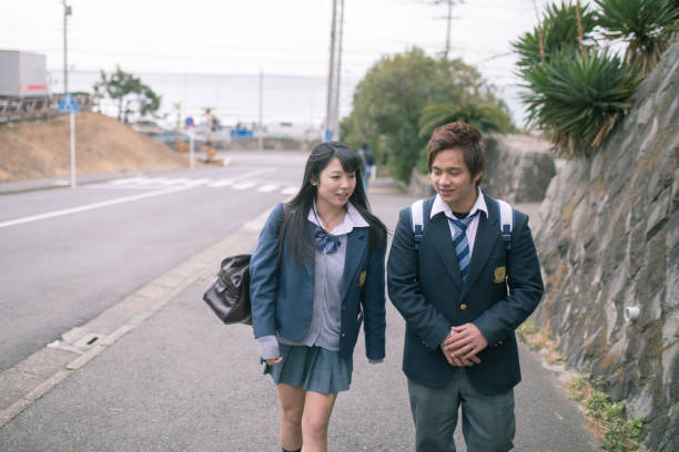 High school student couple going to scholl High school student couple going to scholl shonan photos stock pictures, royalty-free photos & images