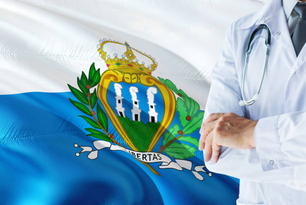 Sammarinese Doctor standing with stethoscope on San Marino flag background. National healthcare system concept, medical theme. san marino médico con estetoscopio sobre fondo de bandera de san marino. concepto de sistema nacional de salud, tema médico. san marino médico con estetoscopio sobre fondo de bandera de san marino. concepto de sistema nacional de salud, tema médico. sa