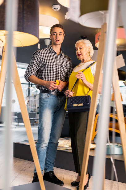 istock Successful man over 25 having conversation with fashionable aging lady 1130578728