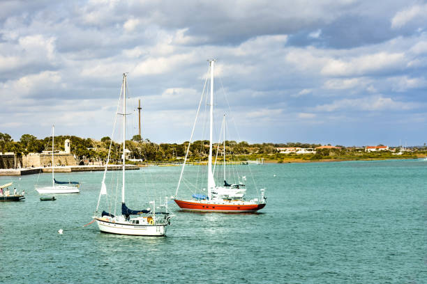 st. augustine, florida. january 26 , 2019. sailboats on light green sea and partial view of castillo de san marcos fort  in florida's historic coast. - orange county california beach imagens e fotografias de stock