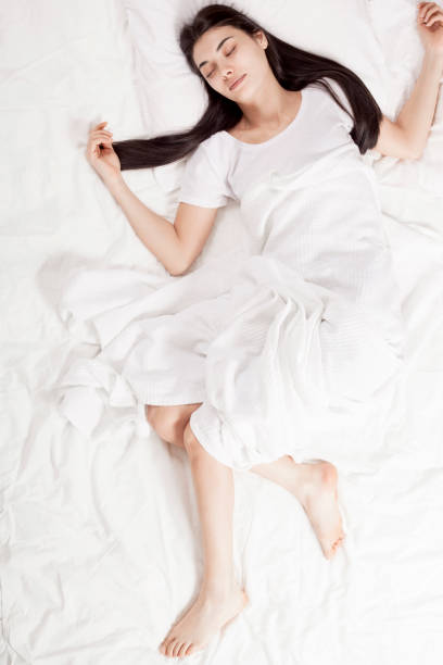 istock young beautiful woman sleeping in bed 1130586012