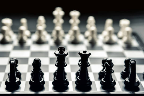 istock Chess board with black and white chess facing each other 1130588759